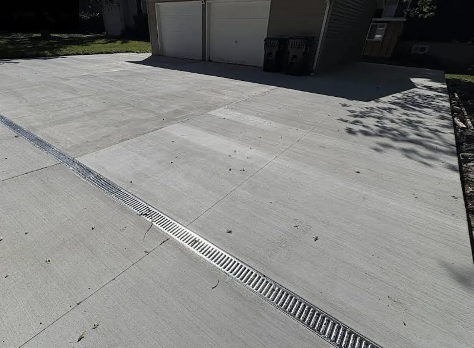 Broom-finish concrete driveway with control joints in Lakemoor IL