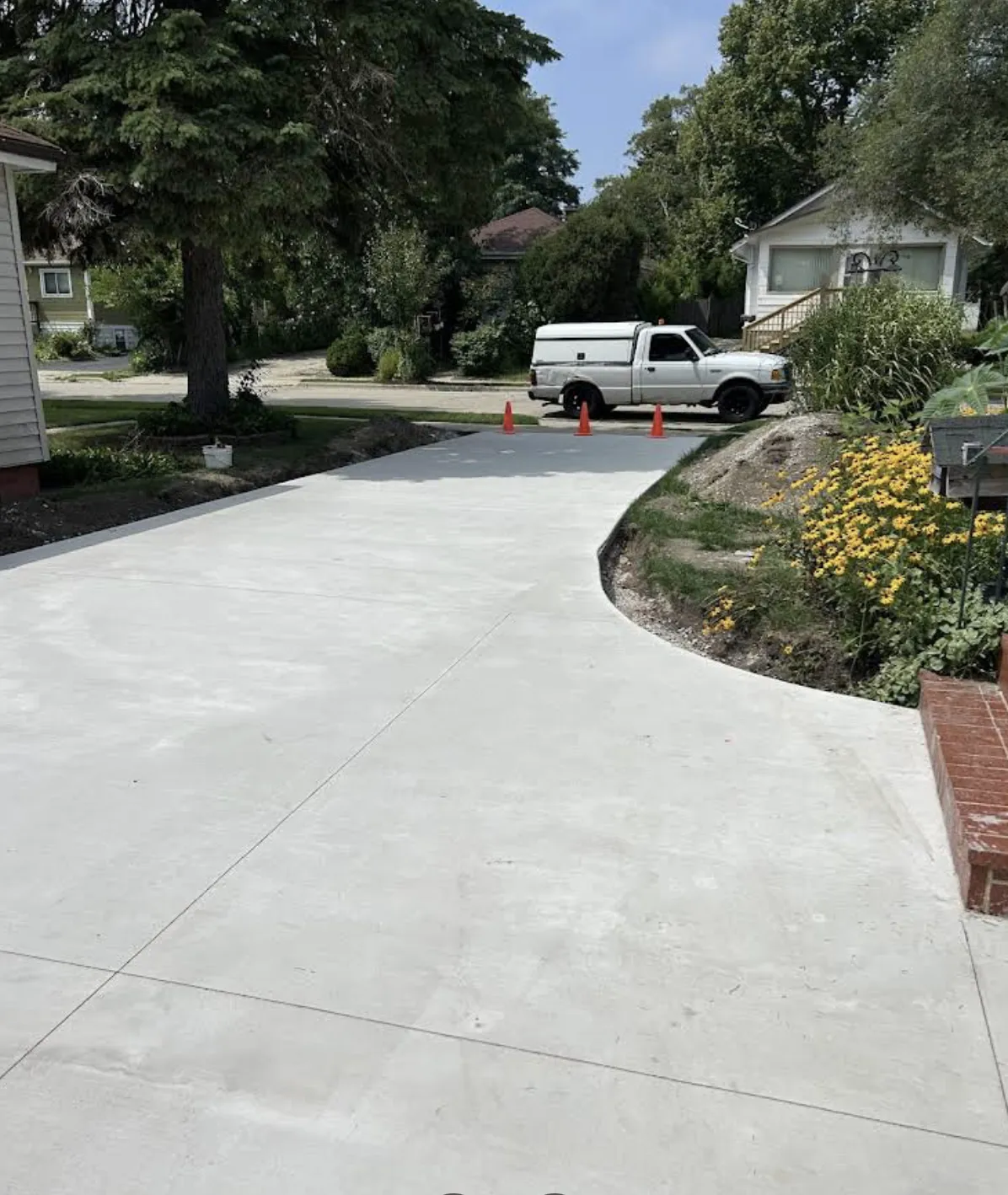 Fresh concrete driveway curing in Round Lake IL