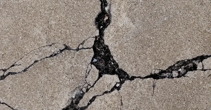 Cracked pool deck surface before resurfacing in Lake Zurich IL