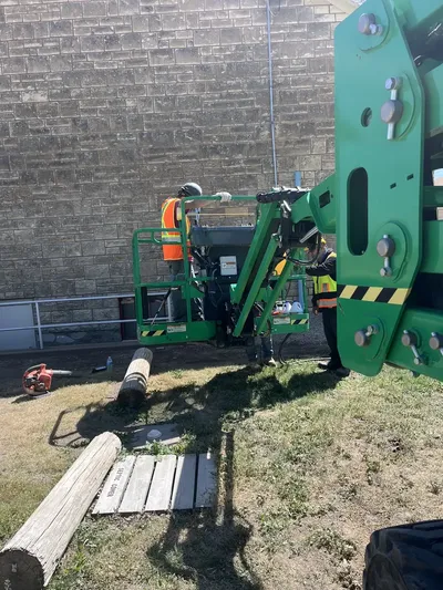 RCC crew operating boom lift platform during commercial masonry restoration